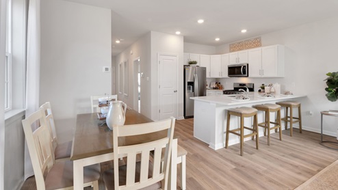 white kitchen with white island