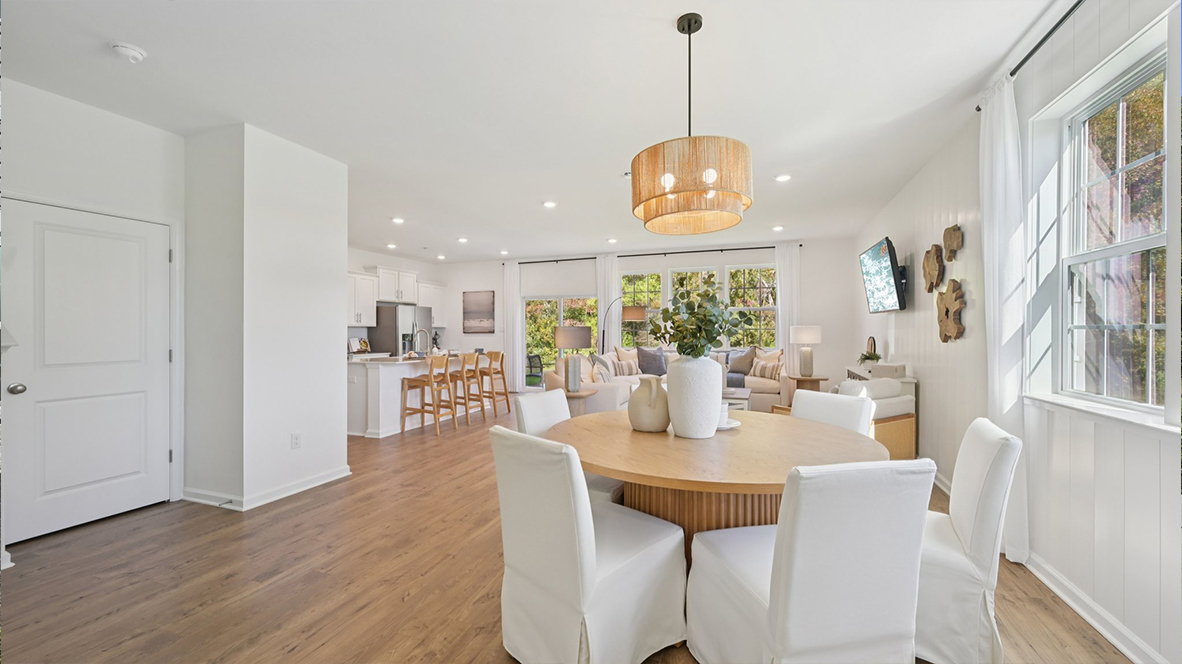open concept living room and round dining table