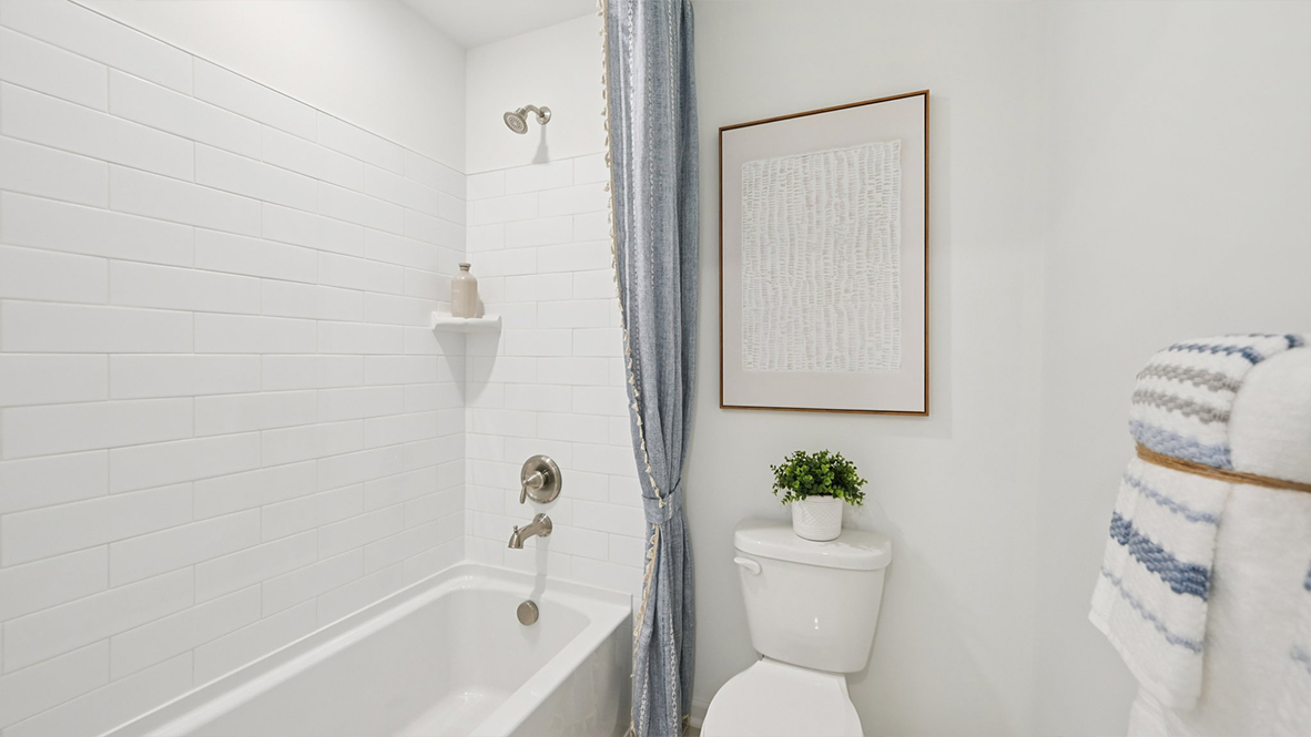 full bath with double vanity off the primary suite
