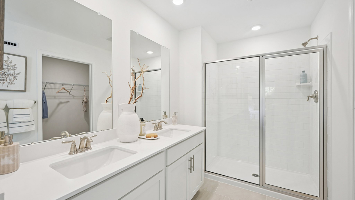 spacious full bath with double vanity off the primary suite