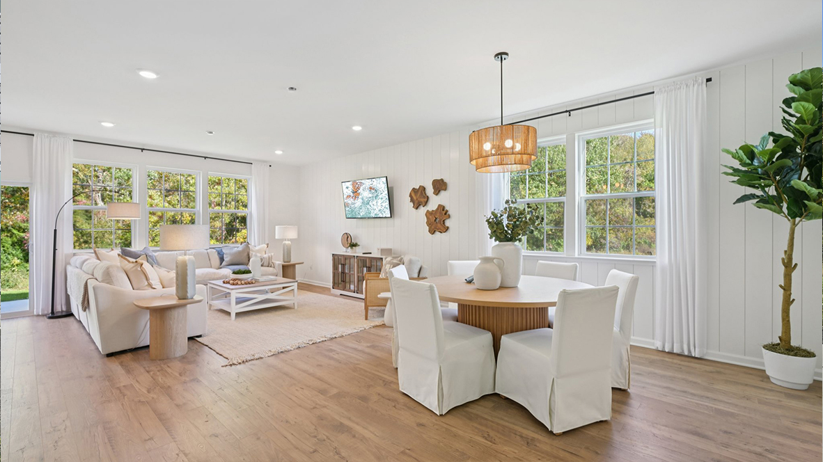 open concept living room with modern design and round table