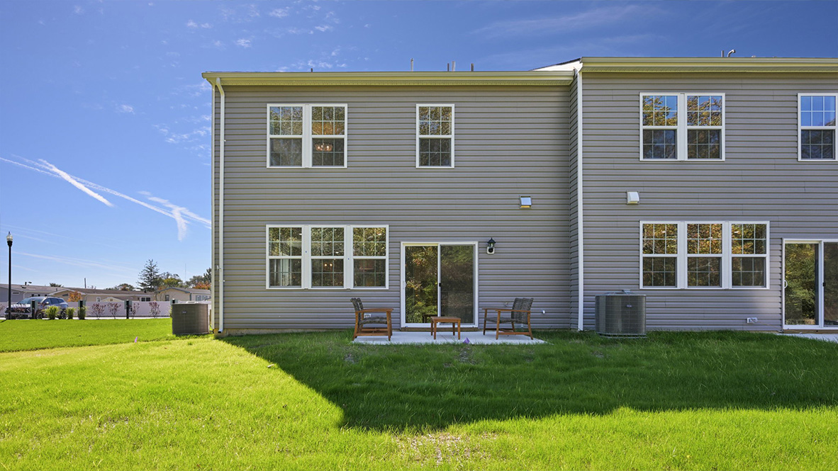 exterior of a crofton model, showcasing the back patio and yard space