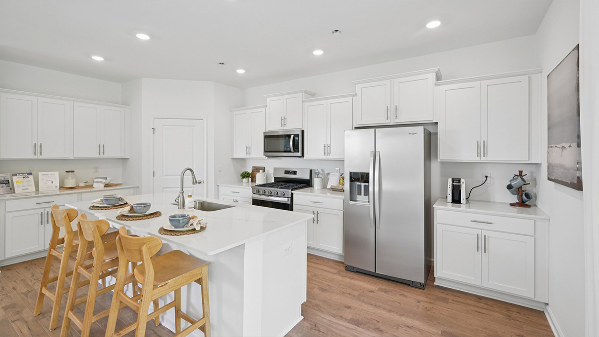 spacious kitchen with large island and coastal touches