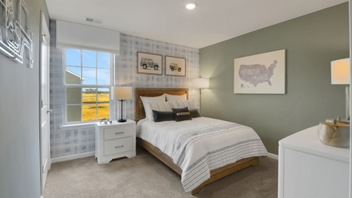 bedroom with beige carpet