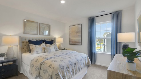 bedroom with beige carpet