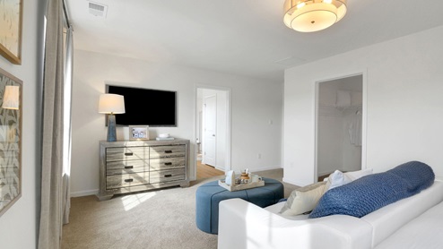 main bedroom with beige carpet
