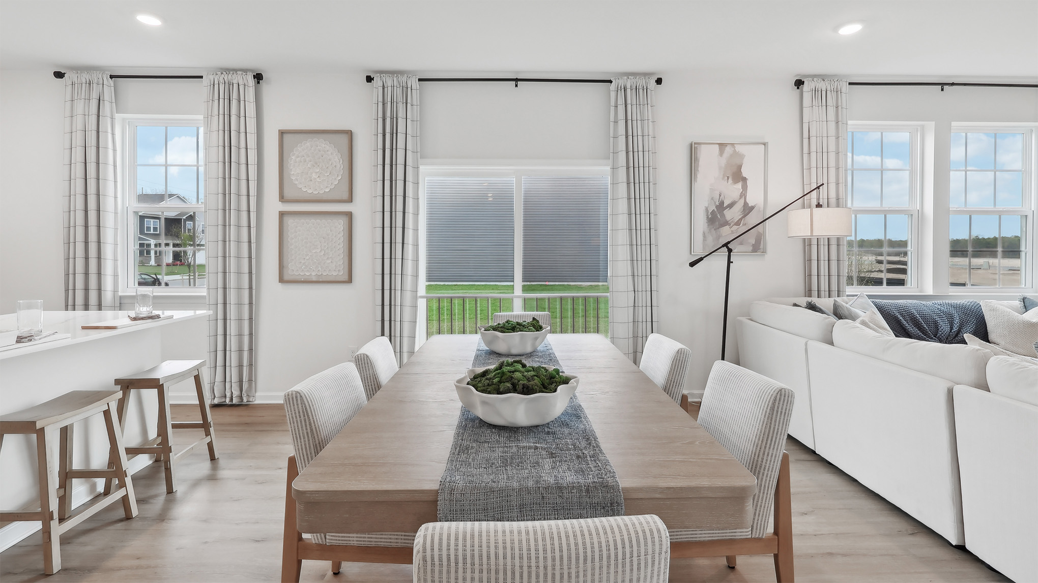 wood dining table with blue runner on the main floor