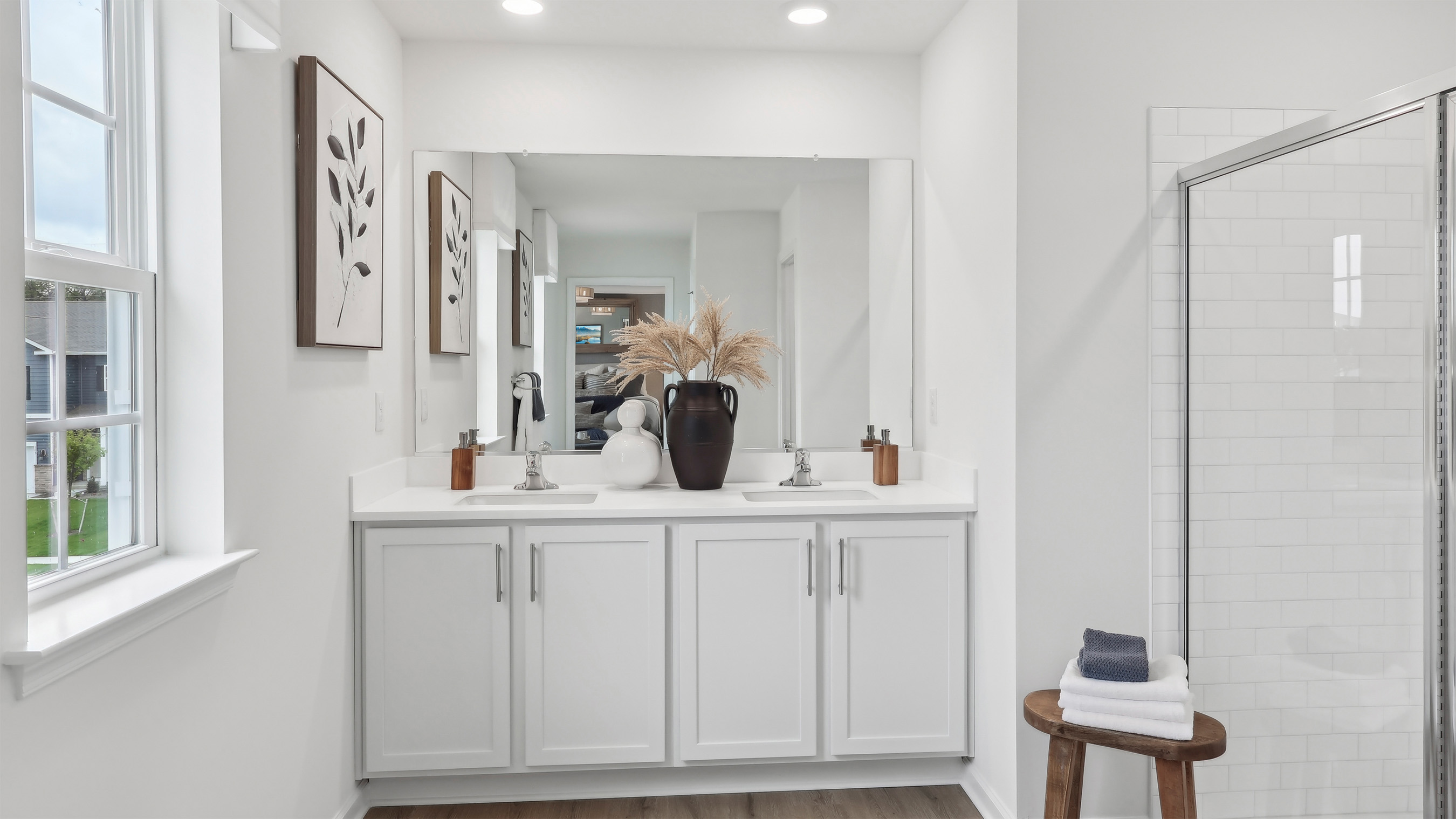 full bath with double vanity off the primary suite