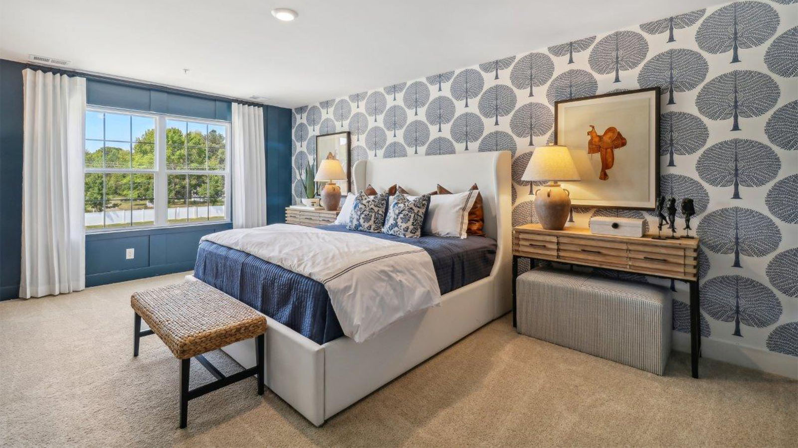 primary bedroom with modern design and large walk in closet and double vanity in full bath