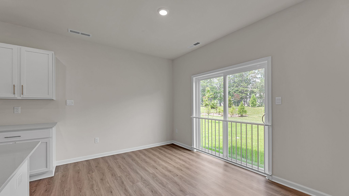 spacious kitchen with large island and access to yard