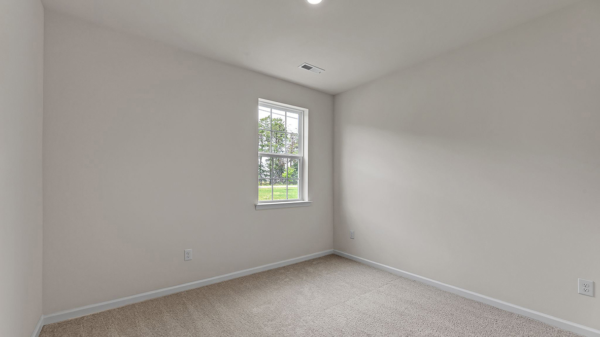 spacious bedroom with large window