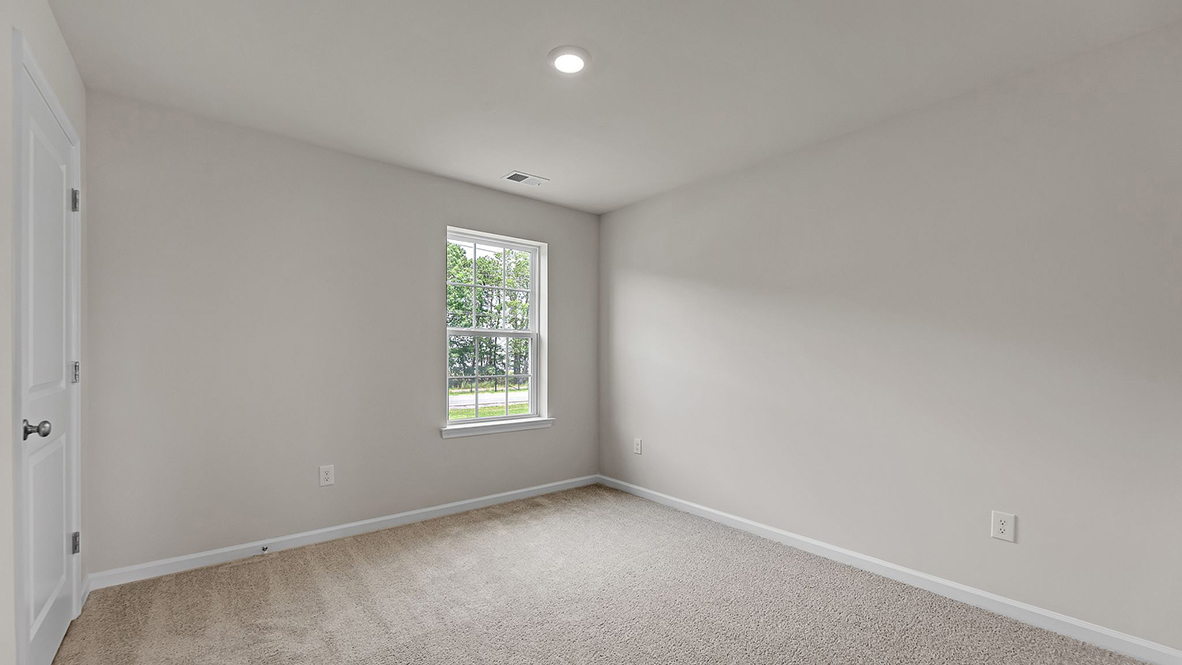 spacious bedroom with large window
