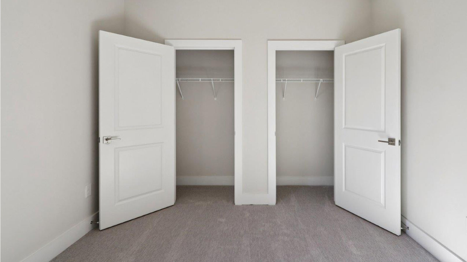 bedroom with two closets