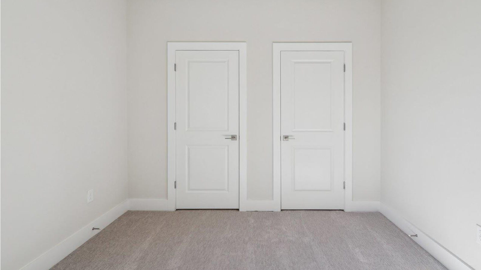 bedroom with two closets
