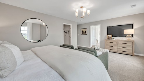 bedroom with beige carpet