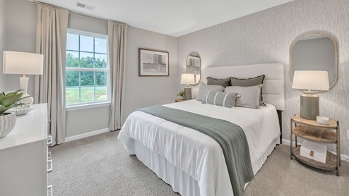 bedroom with beige carpet