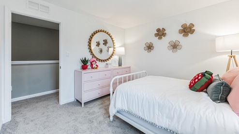 bedroom with beige carpet