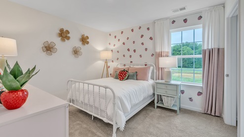 bedroom with beige carpet