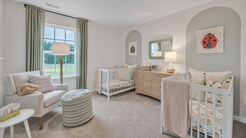 bedroom with beige carpet