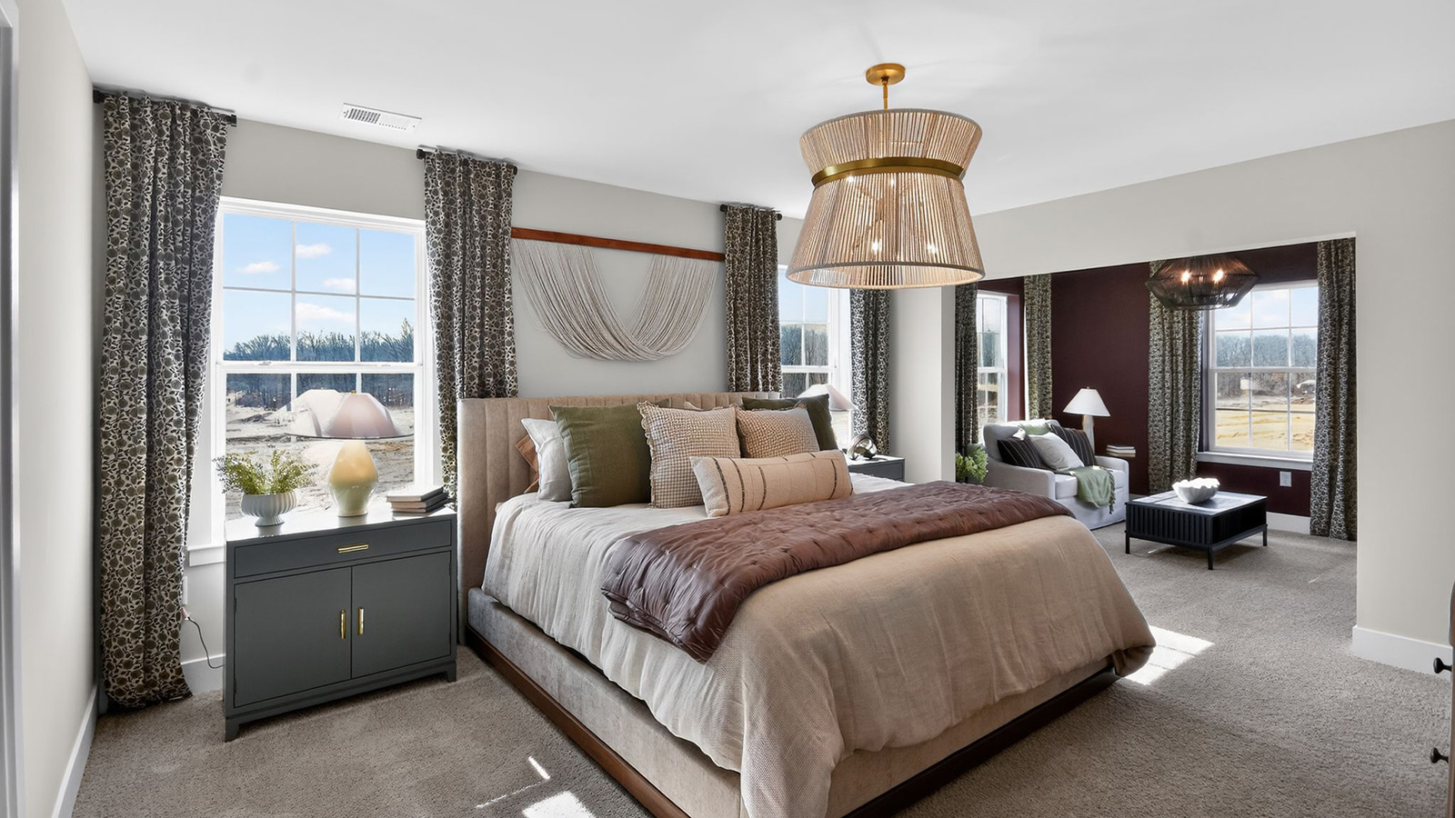 primary bedroom with modern design and large full bath and walk in closet
