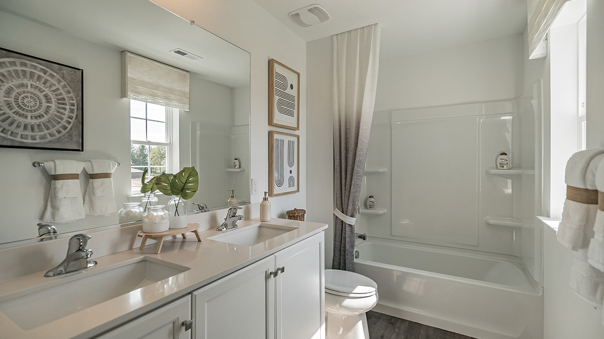full bath with double vanity sinks