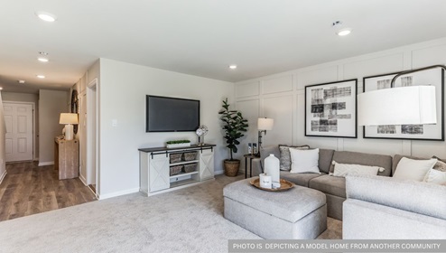 first floor flex room with beige carpet