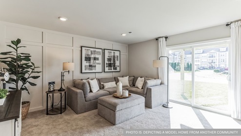 first floor flex room with beige carpet