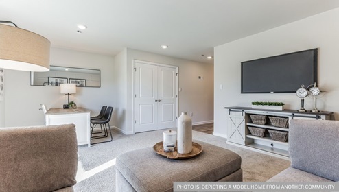 first floor flex room with beige carpet