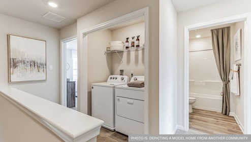 3rd floor landing with washer and dryer area