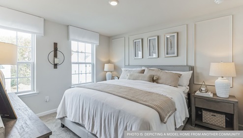 bedroom with beige carpet