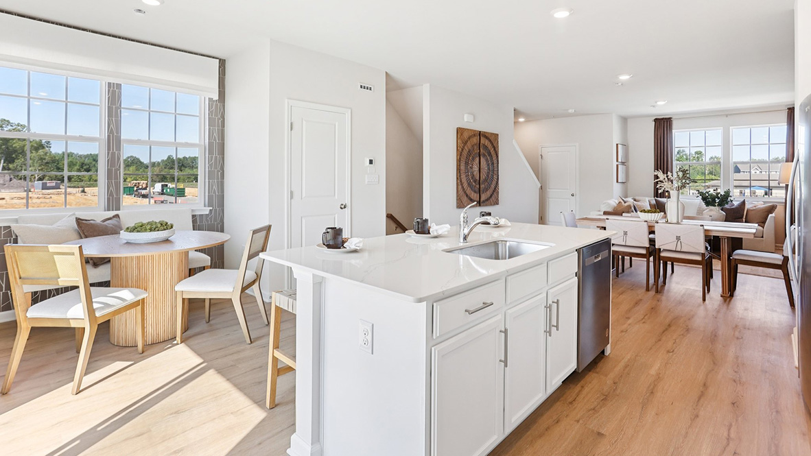 quartz island in the kitchen with white cabinetry