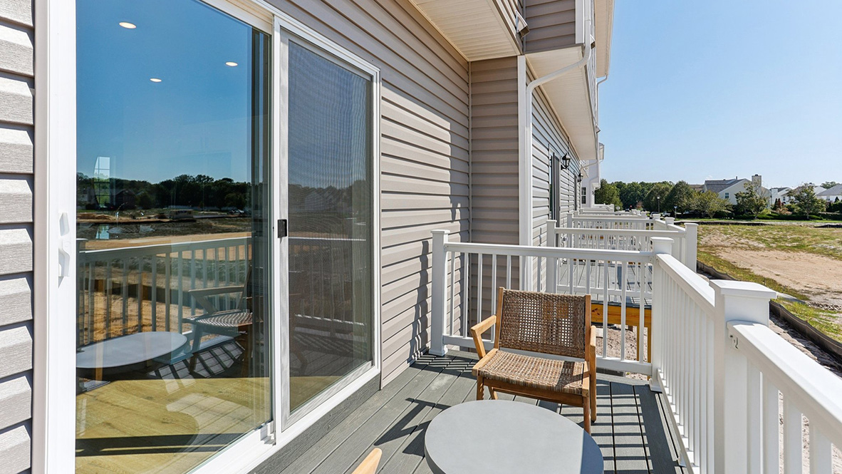 balcony off the second floor with seating