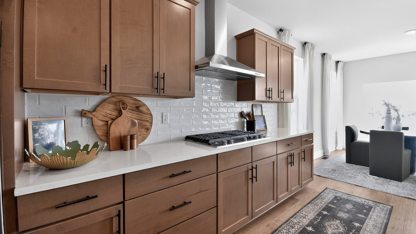 large kitchen with white quartz island and butterscotch cabinets