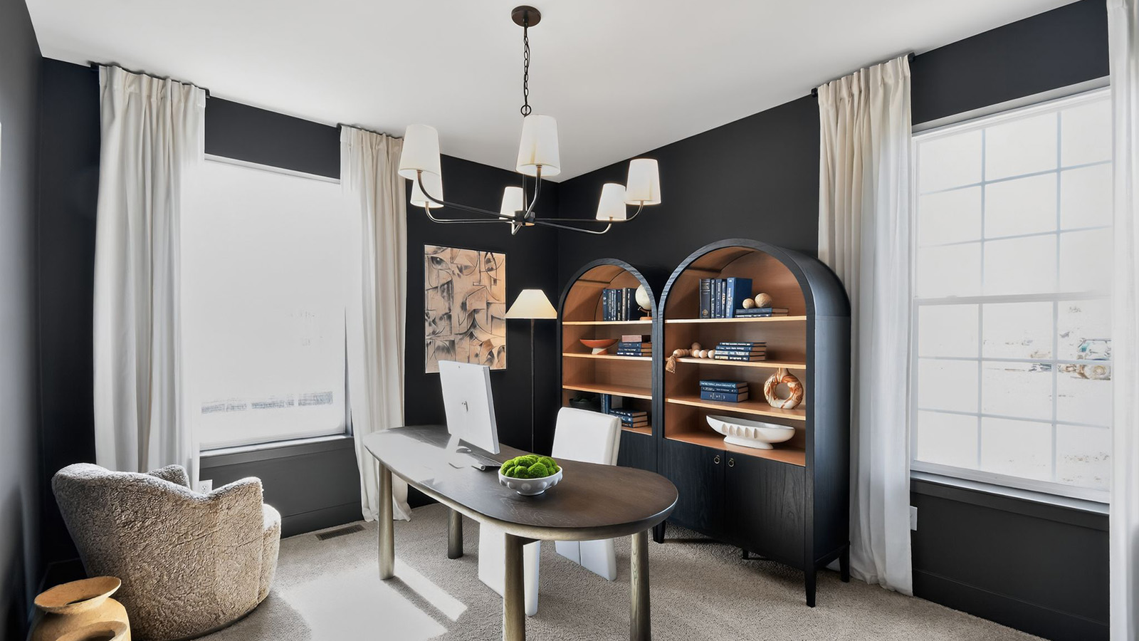 office tucked away with large windows and mood design