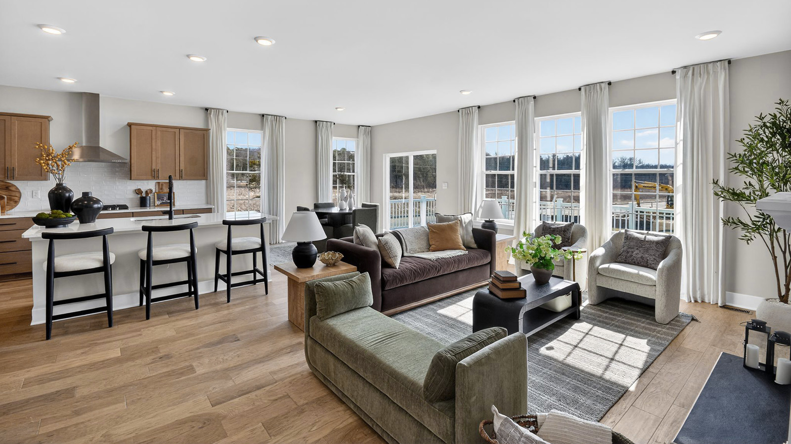 open concept living room and spacious kitchen with large quartz island
