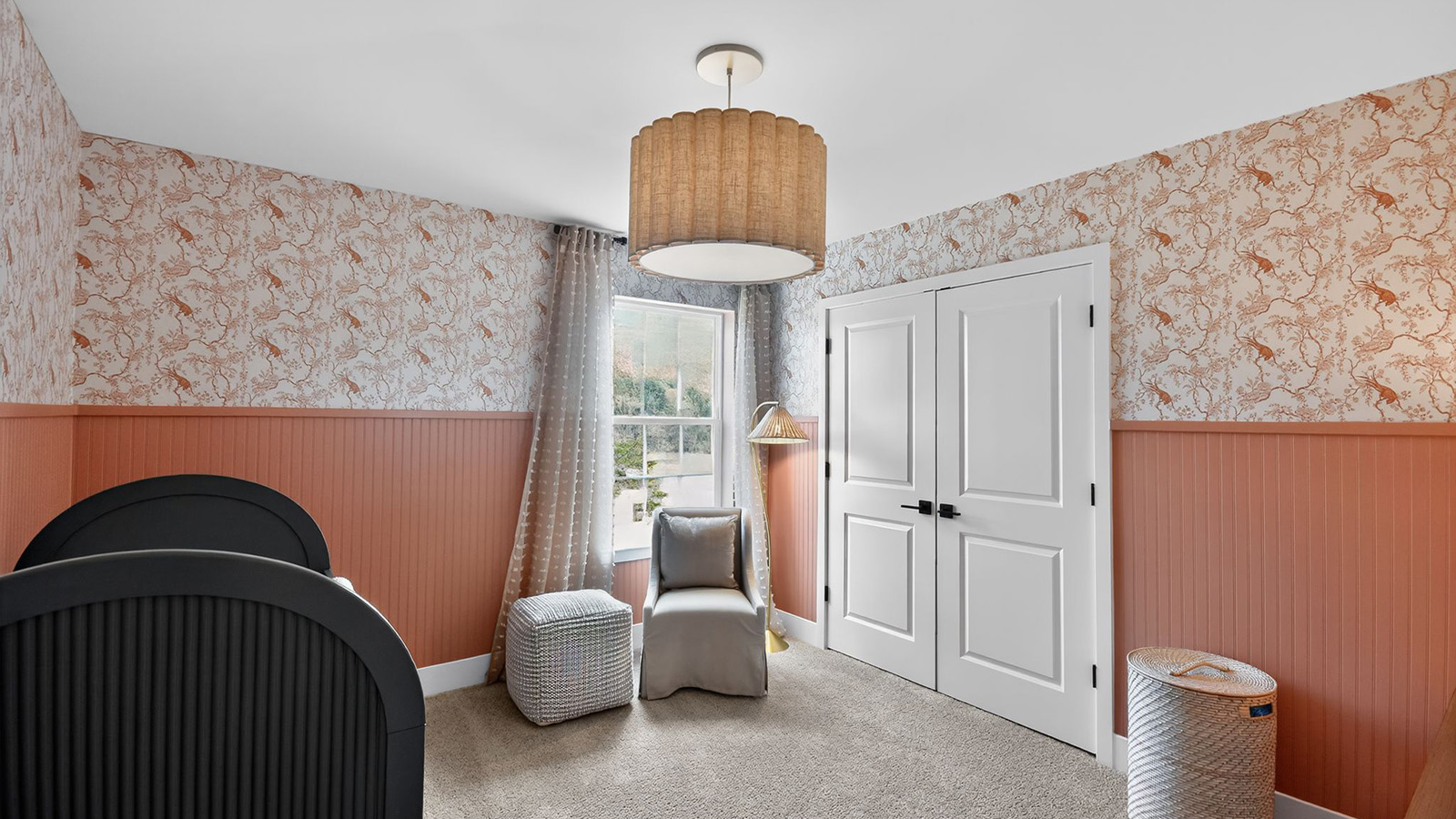 nursery room with butterfly design and large window