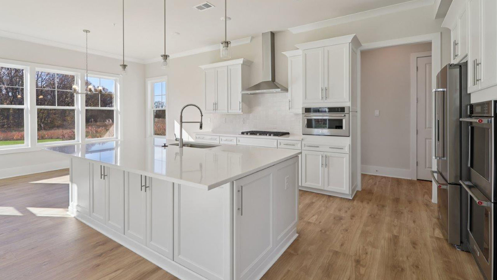 spacious first floor featuring the large kitchen island and open concept living room