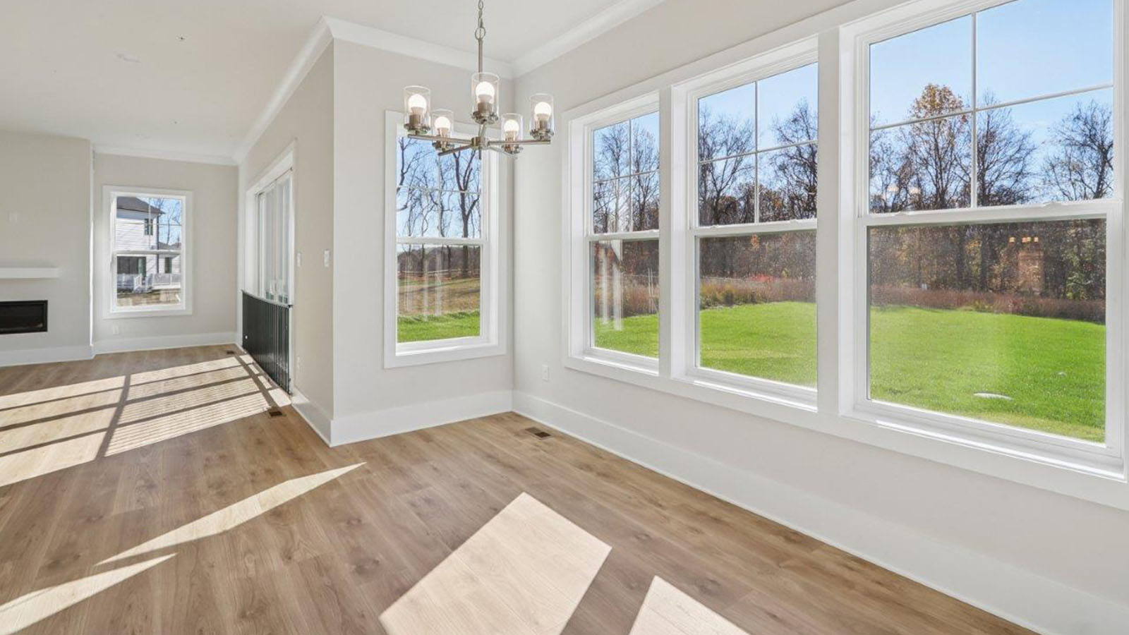 spacious open concept living room with fireplace