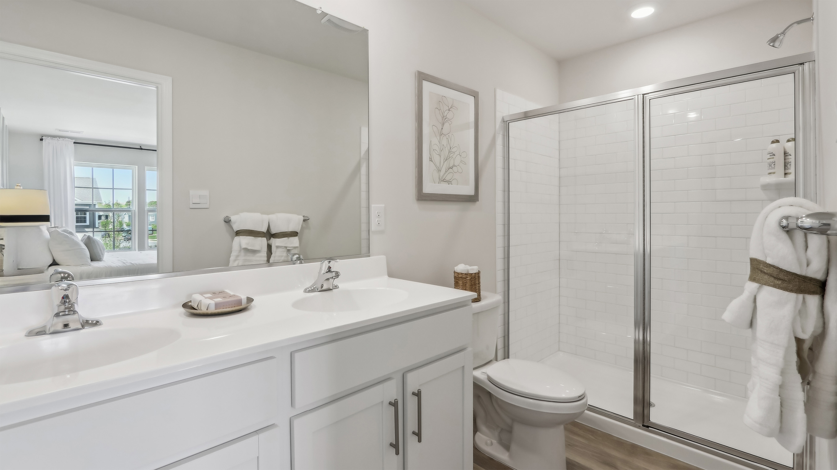primary bedroom with full bath and walk in closet