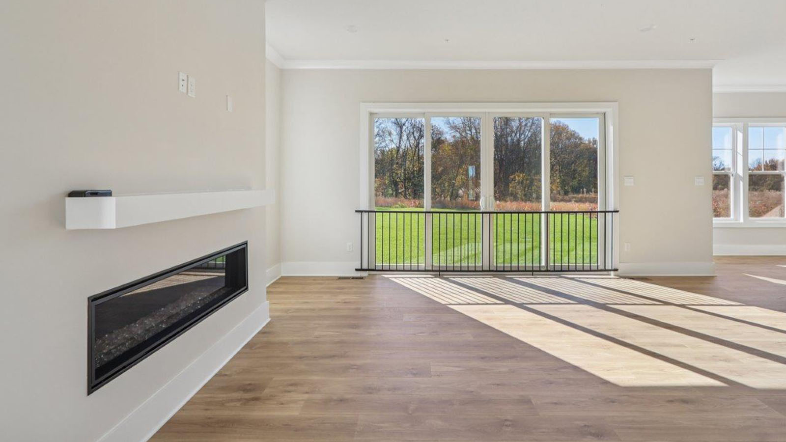 beautiful open concept living room and fireplace feature