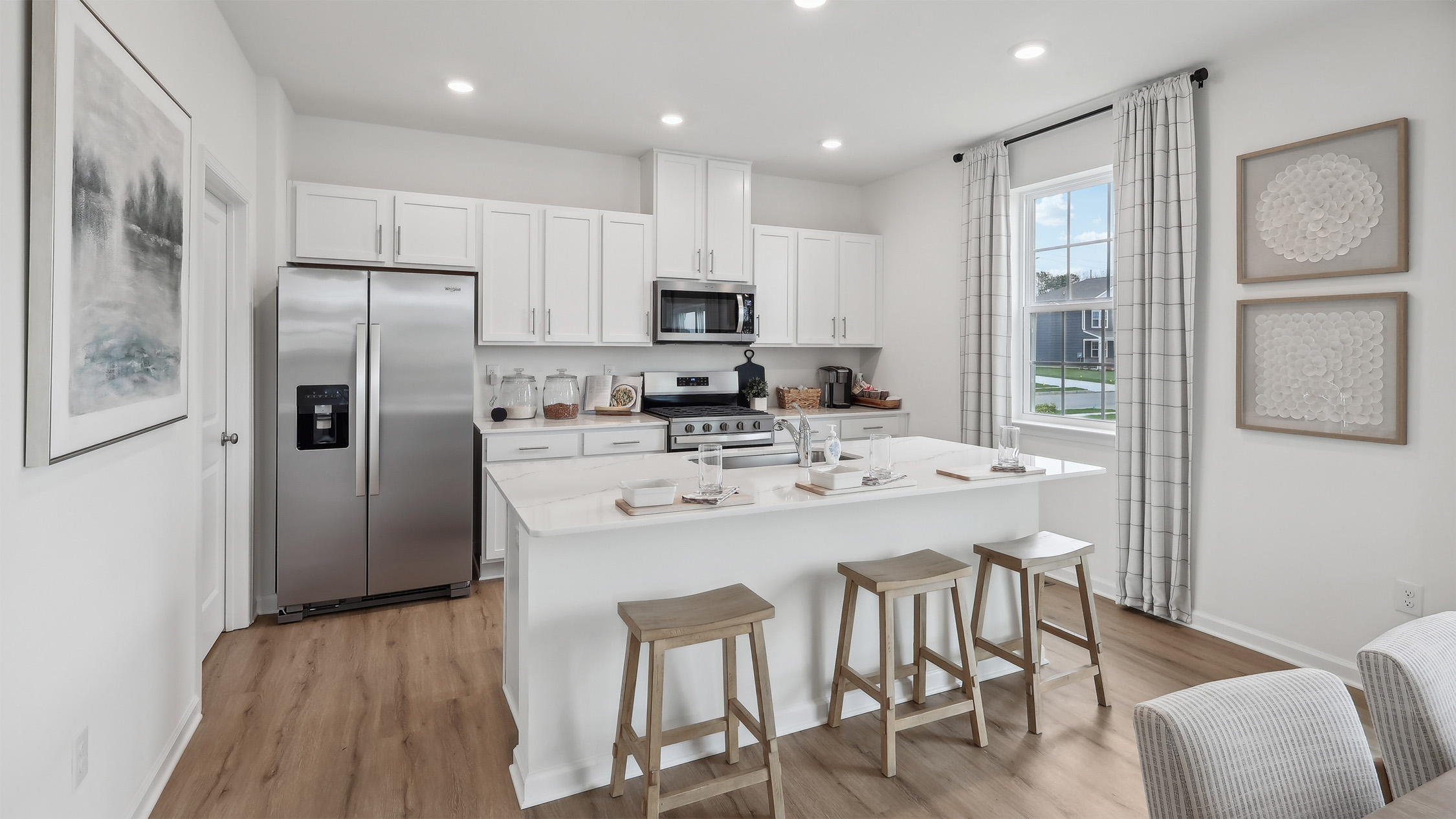 large kitchen island and top of the line appliances