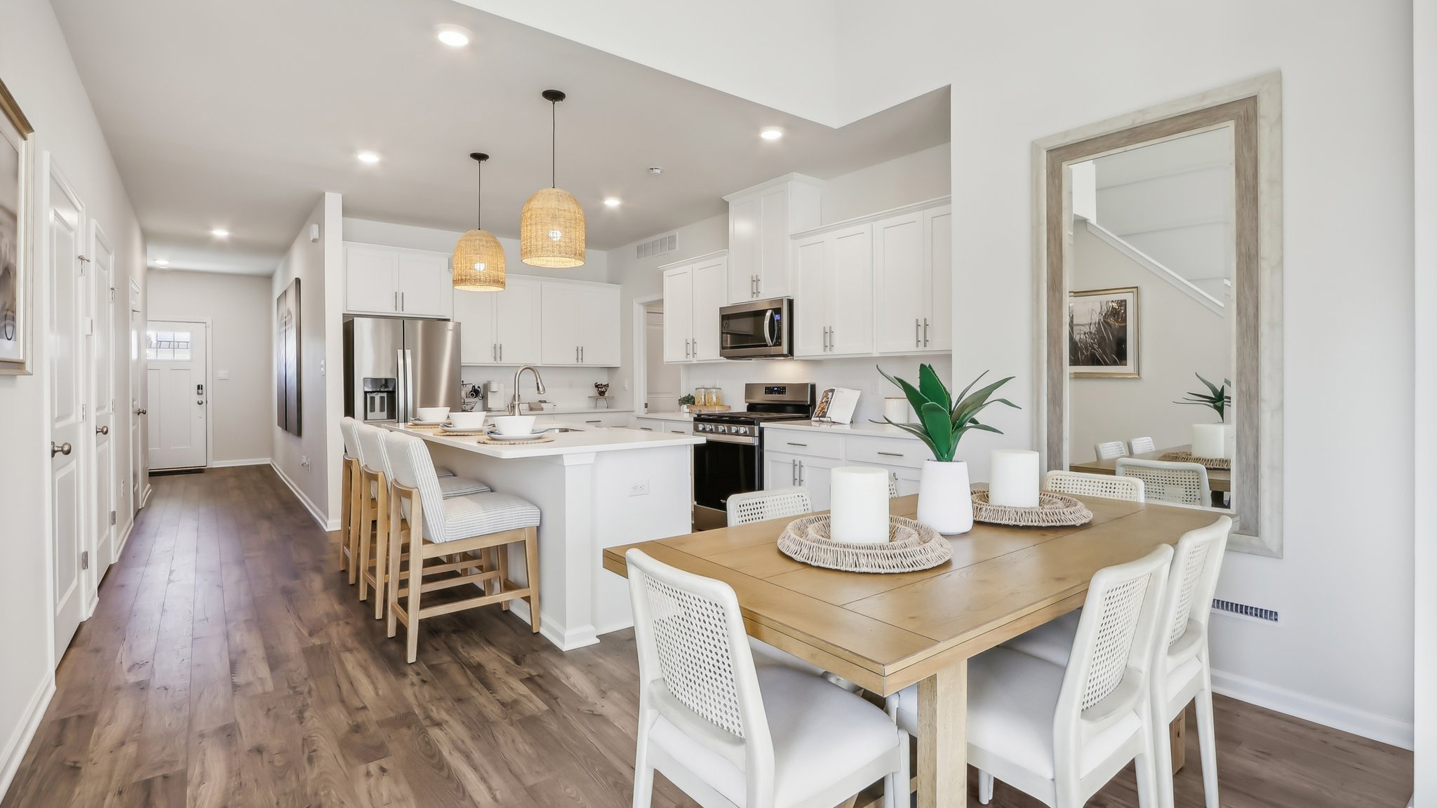 spacious main floor featuring the dining table and kitchen