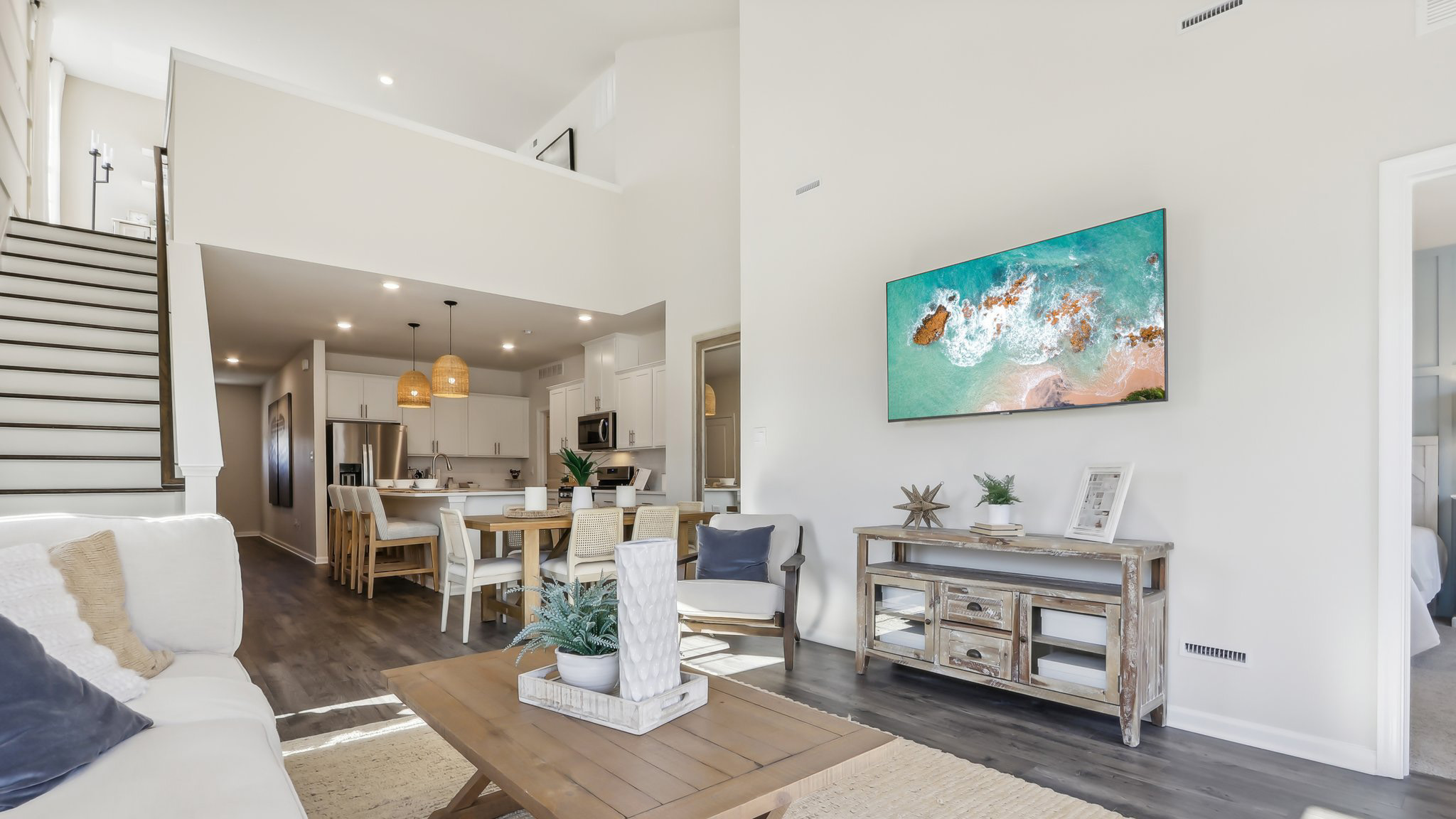 spacious living room with modern design and upstairs loft