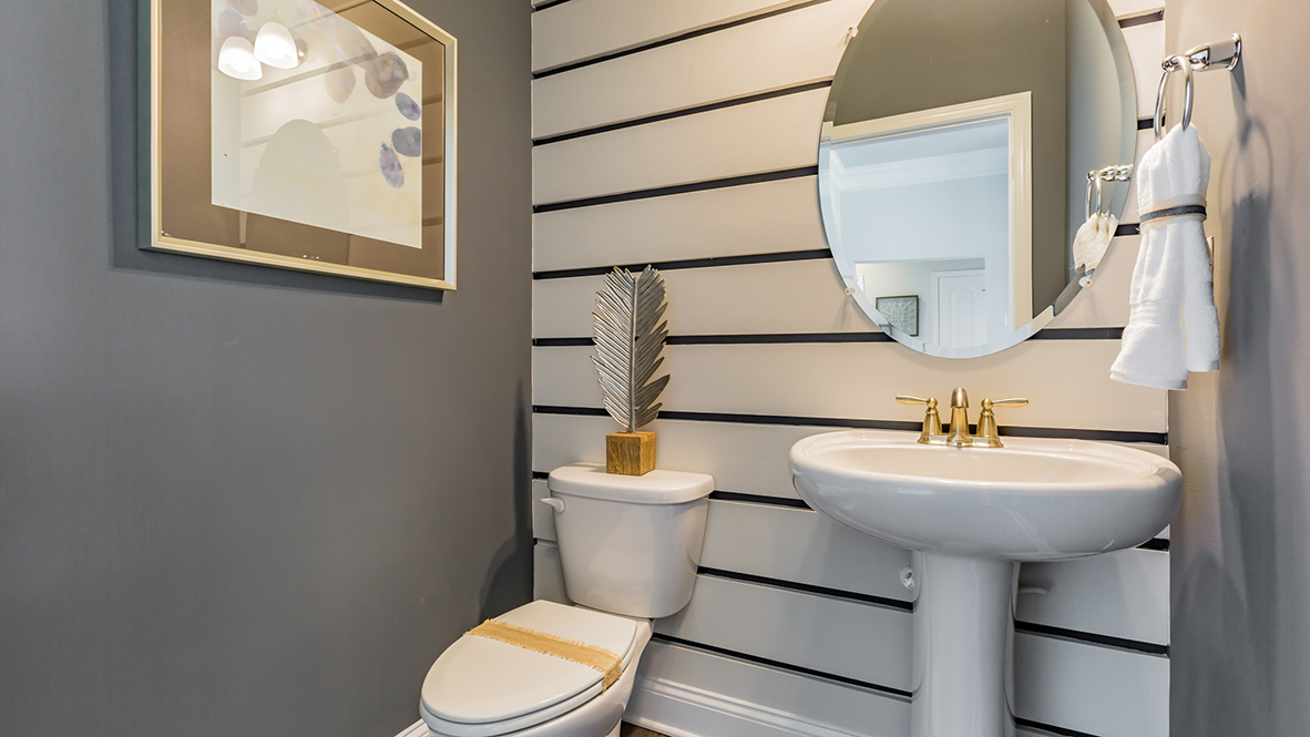 The powder room is located just off the foyer.