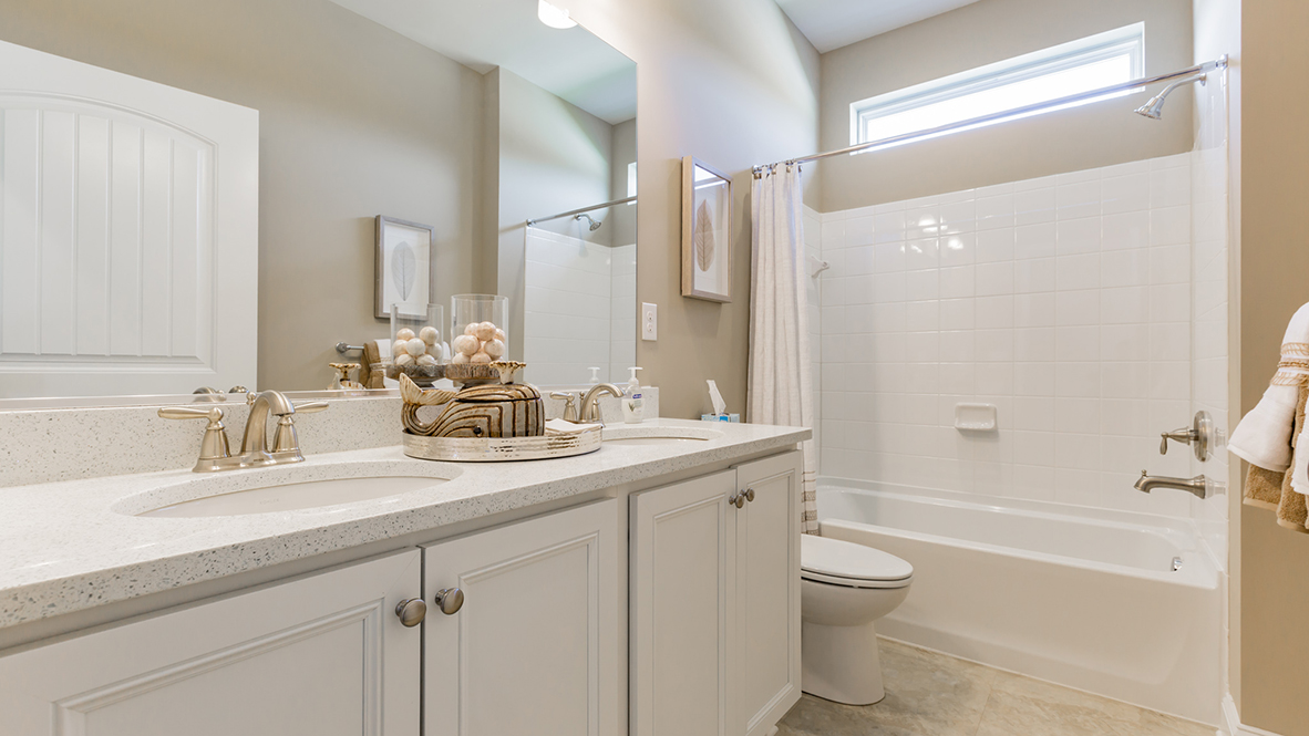 Two additional bedrooms are located on the main level sharing the second bathroom.