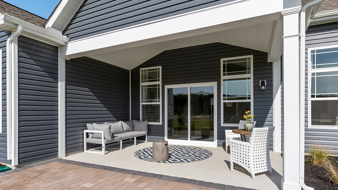 Relax on your cozy covered screened porch.