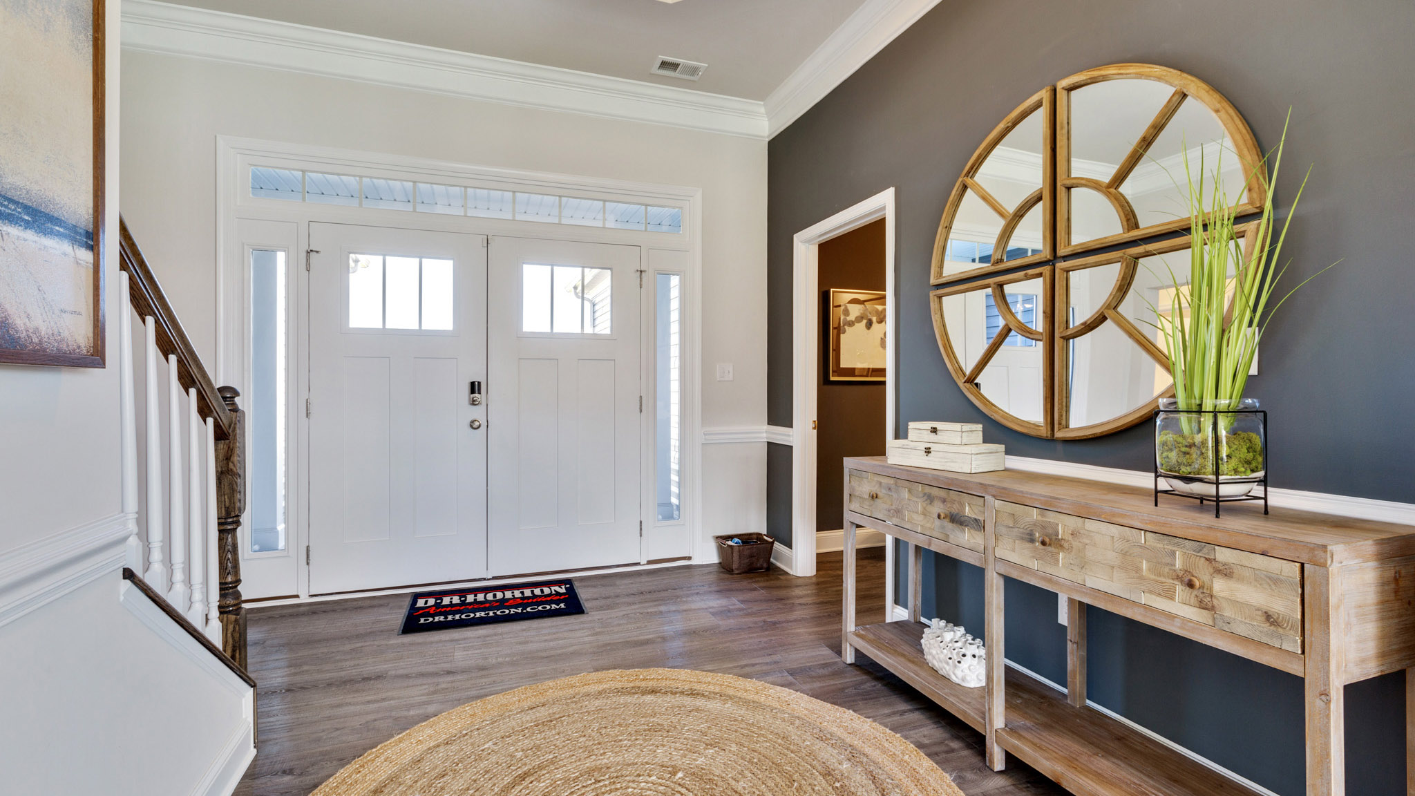 The welcoming foyer showcases a tray ceiling.