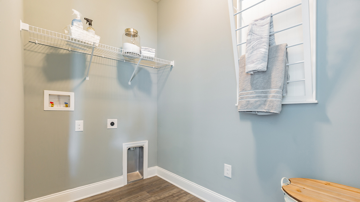 The laundry room is conveniently located off the kitchen.
