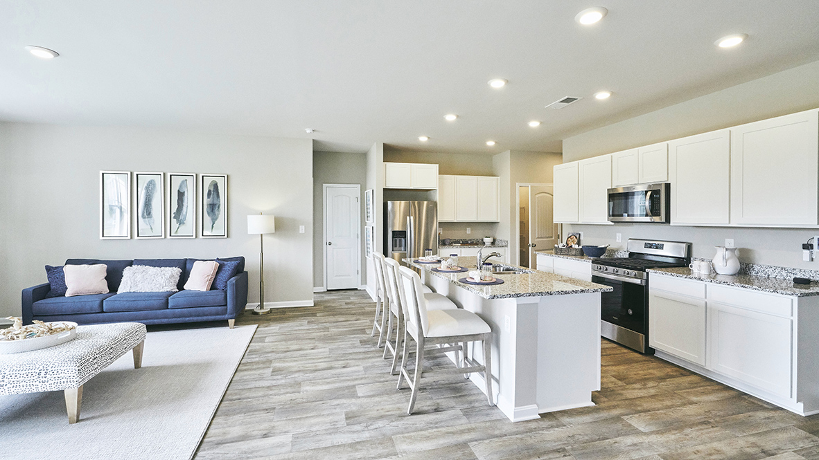 The home's well-designed kitchen features an oversized island with room for seating.