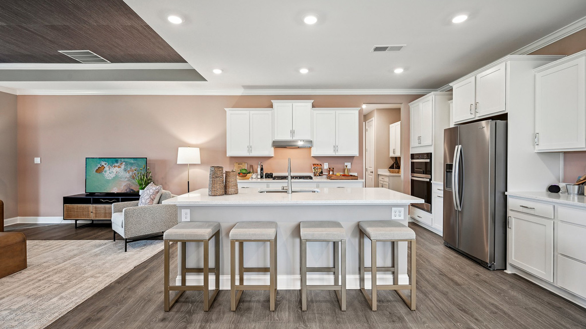 The kitchen has an oversized island with a sink.
